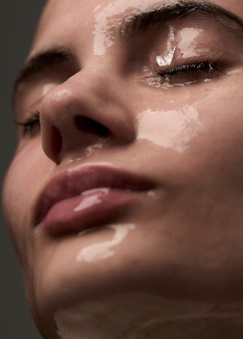 Wet woman's face close up