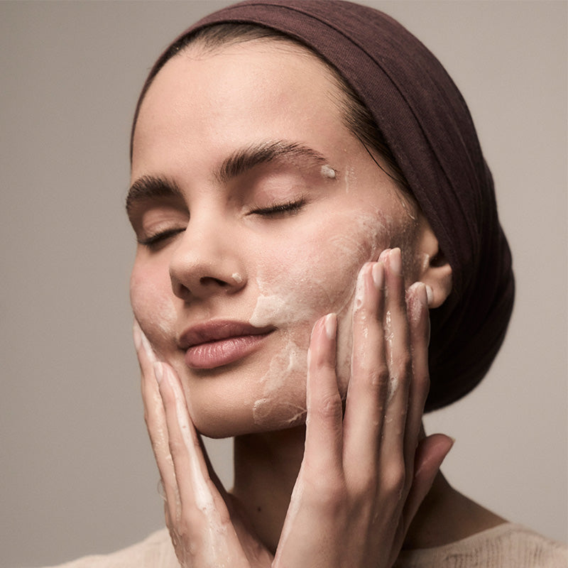 Rising Tides Facial Cleanser on woman&#39;s face